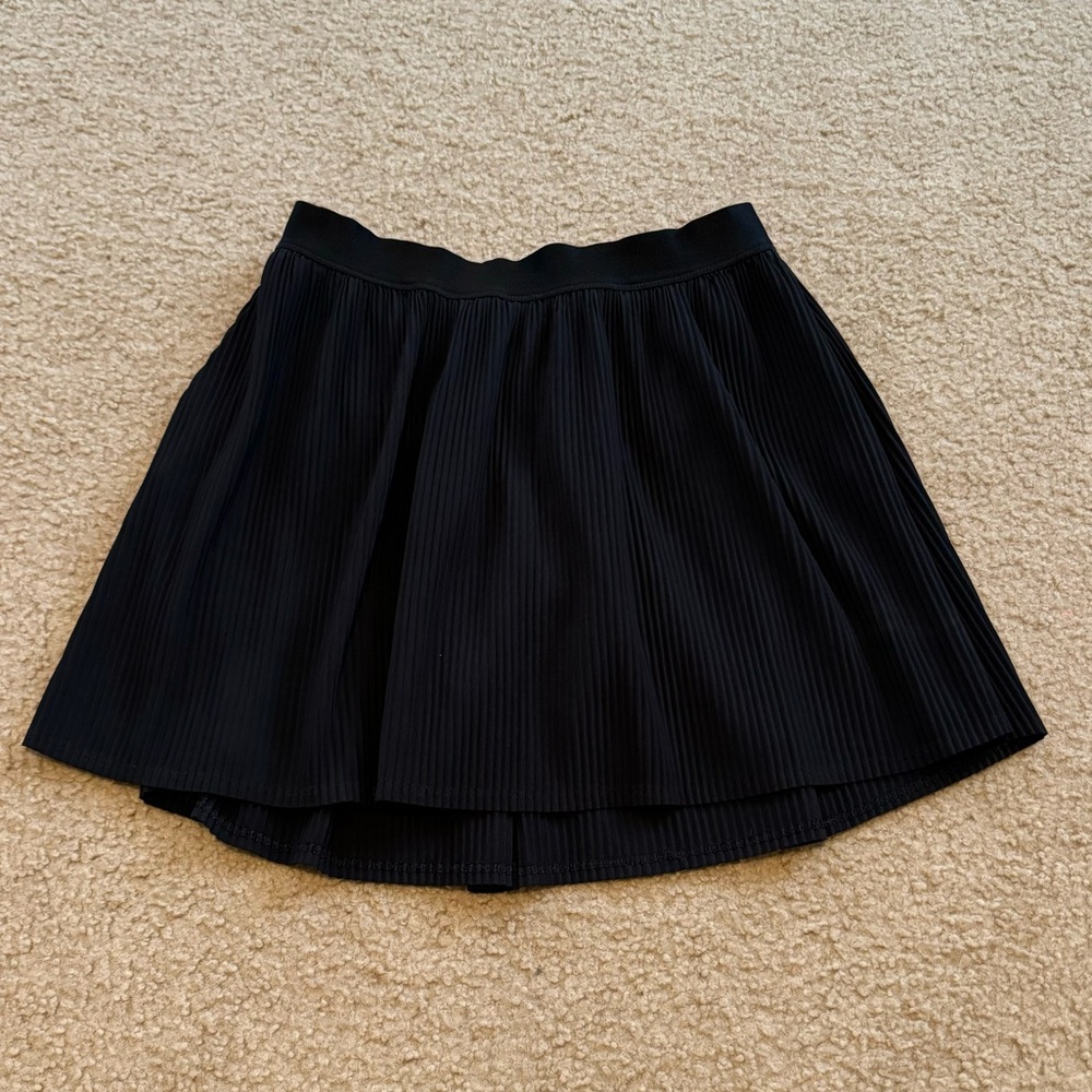 Girls black pleated skirt with elastic waistband